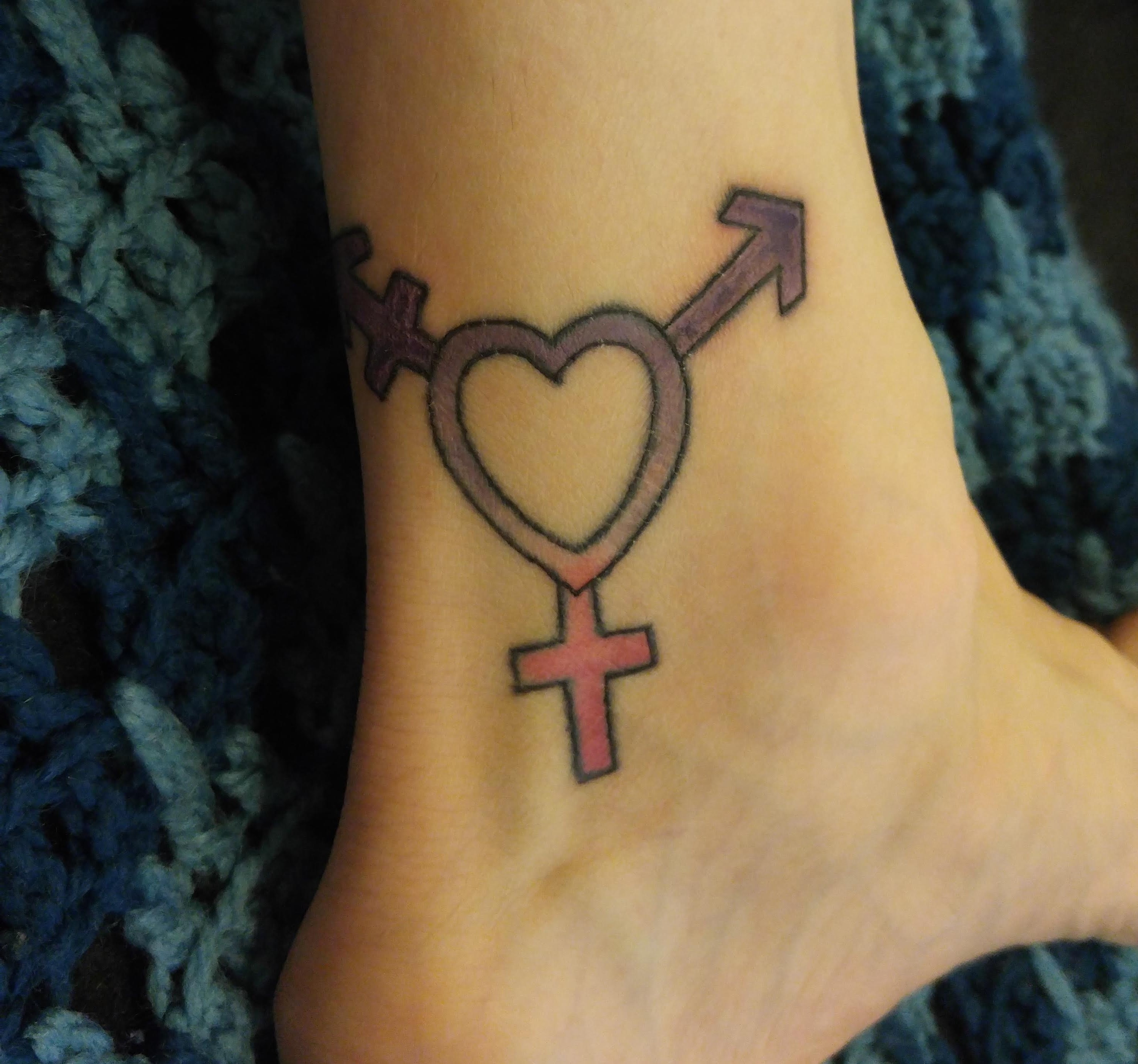 Two extra branches added to the female symbol to turn it into a transgender symbol.