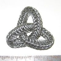 A chainmaille knot on a bright background