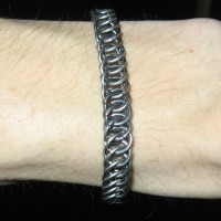 A chainmaille bracelet on Kabutroid's wrist