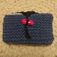 A knitted envelope holder, in blue.