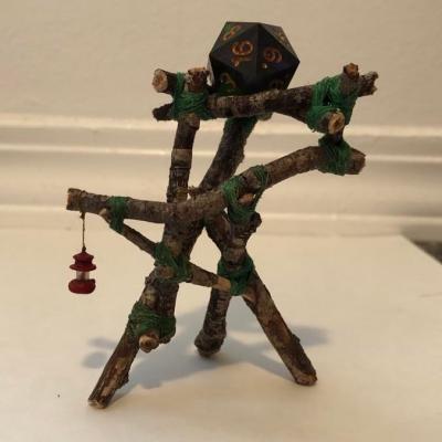 A rickety looking structure with a dice on top