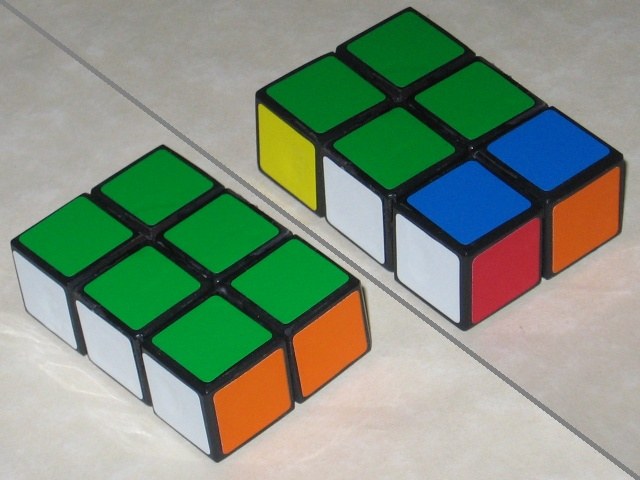 A solved and unsolved 3x2x1 Rubik's Cube