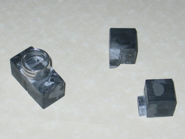 Two pieces with matching pegs held together with Kabutroid's chainmailling ring, convenient size, and the ring being used to make the pegs properly round.