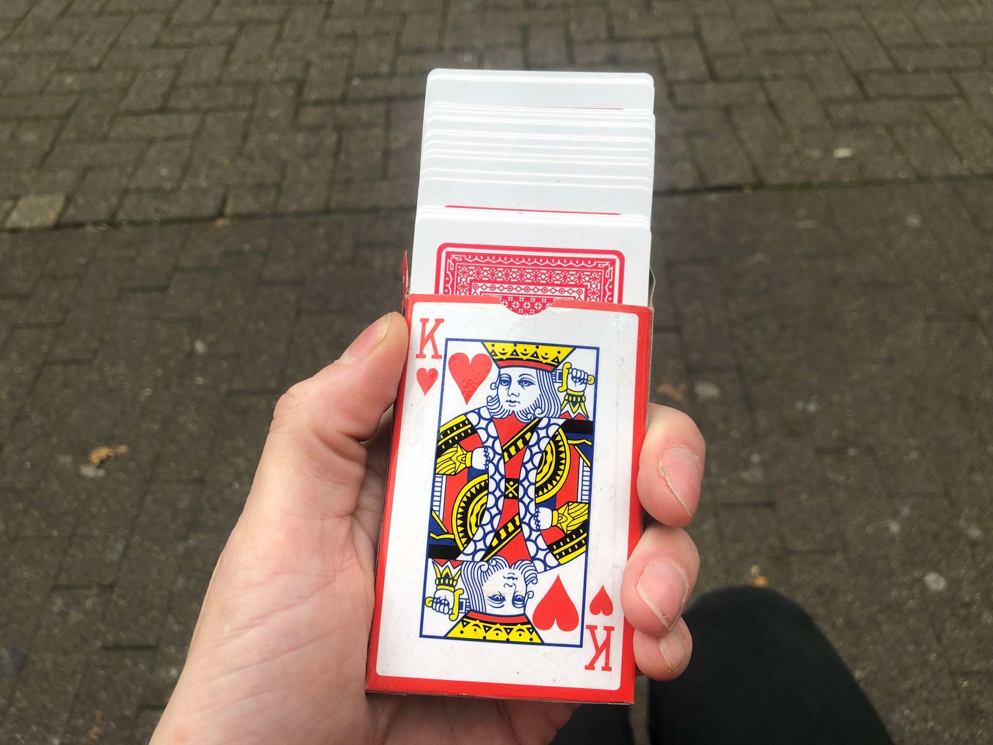 The box flap opened, and the cards spread partially out of the box in front of you.