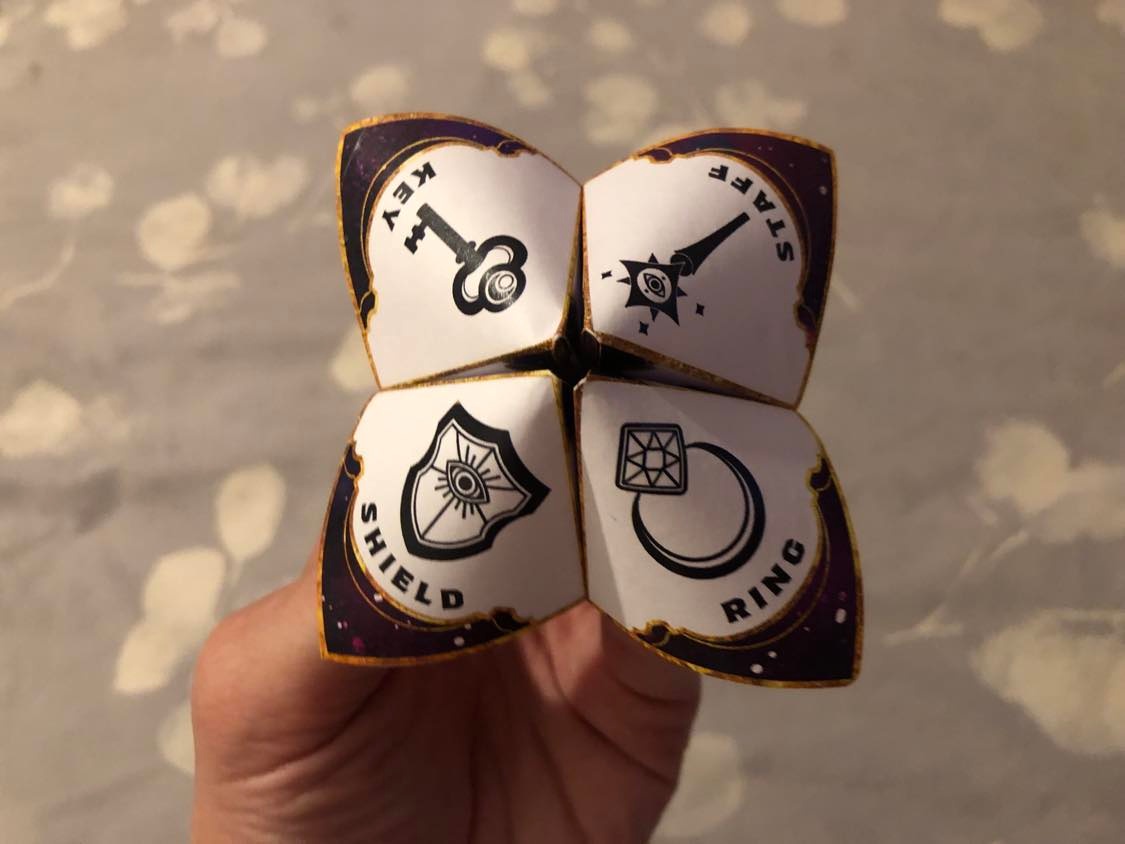 A paper fortune teller, what a curious device! Held and ready to bring you your future.